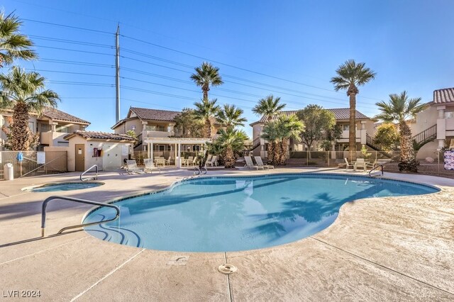 view of swimming pool with a patio