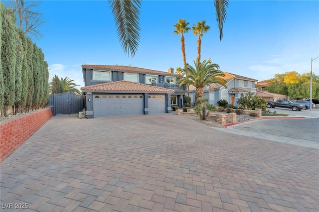 mediterranean / spanish house featuring a garage