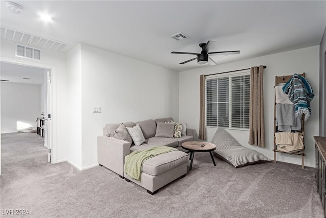 living room with carpet flooring and ceiling fan