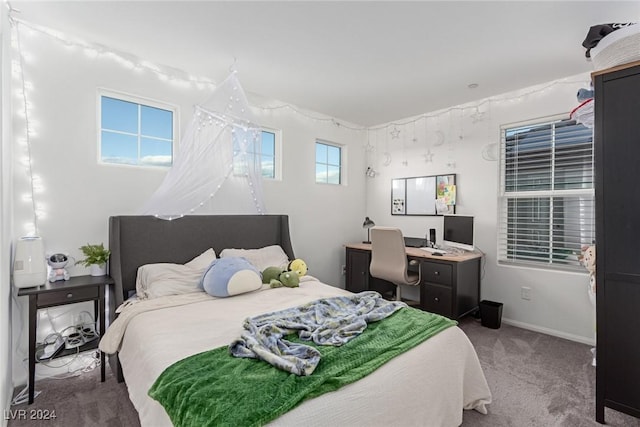 carpeted bedroom featuring multiple windows