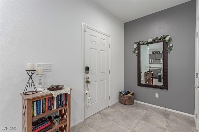 entryway featuring light tile patterned floors