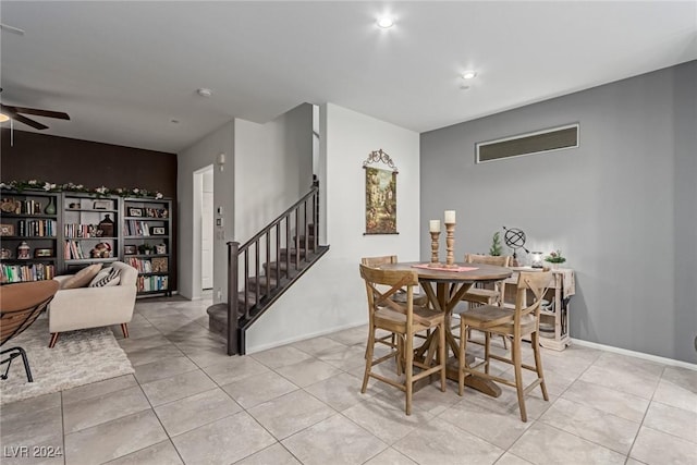 tiled dining area featuring ceiling fan