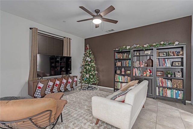 living room featuring ceiling fan and light tile patterned floors