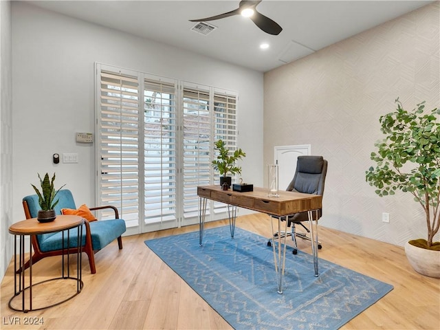 office with hardwood / wood-style floors and ceiling fan