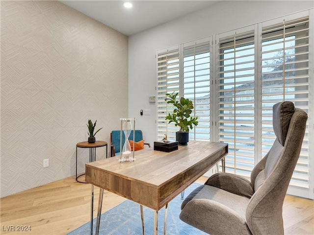 office space with wood-type flooring