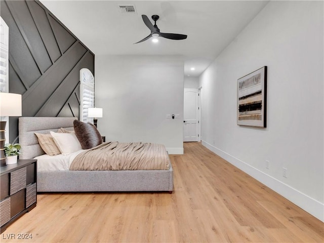 bedroom featuring ceiling fan and light hardwood / wood-style floors