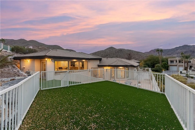 yard at dusk with a mountain view