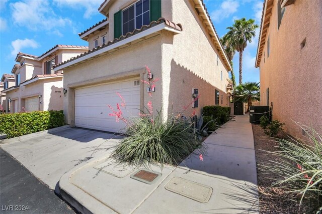 view of property exterior with a garage