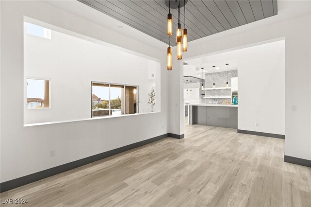 unfurnished living room featuring light hardwood / wood-style flooring