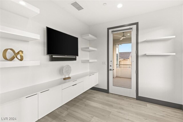 unfurnished living room featuring light hardwood / wood-style flooring