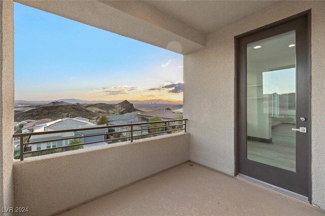 balcony at dusk with a mountain view