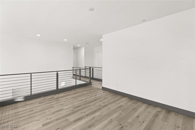 unfurnished room with light wood-type flooring