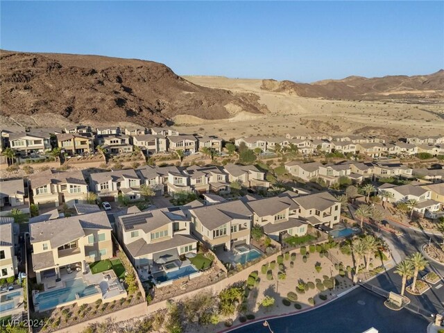 birds eye view of property with a mountain view