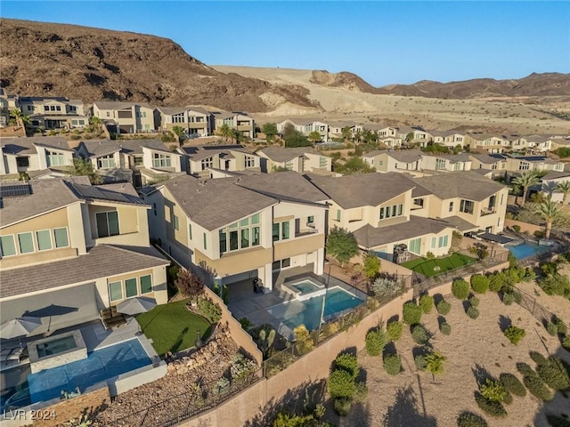 birds eye view of property with a mountain view