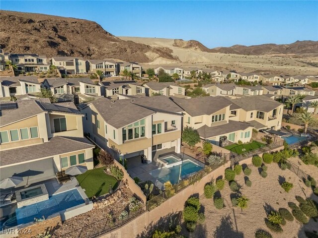 birds eye view of property with a mountain view