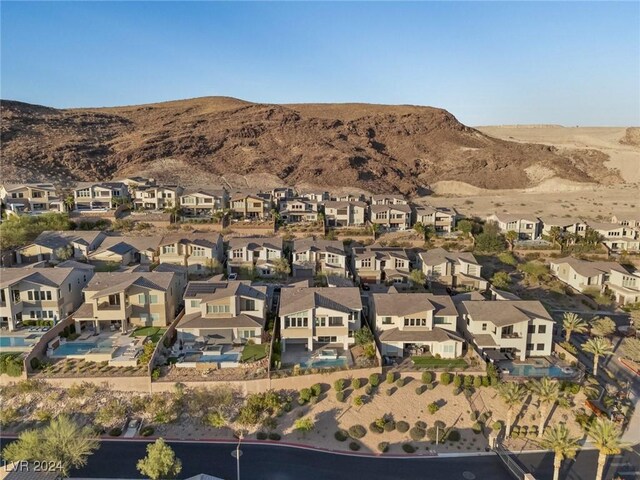 birds eye view of property with a mountain view