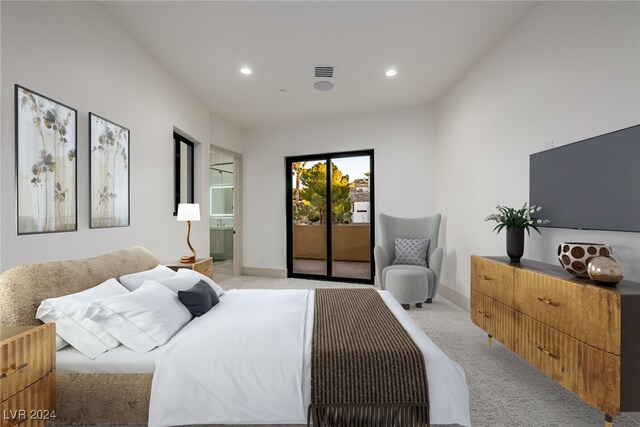 bedroom featuring access to exterior and light colored carpet