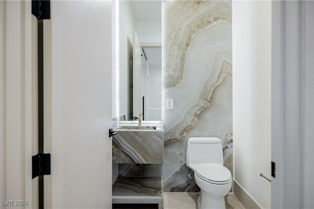 bathroom featuring sink and toilet