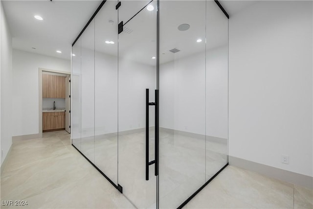 interior space featuring concrete floors and sink