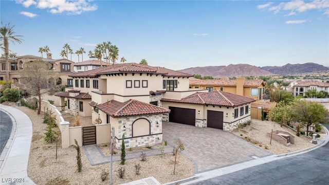 mediterranean / spanish home featuring a garage