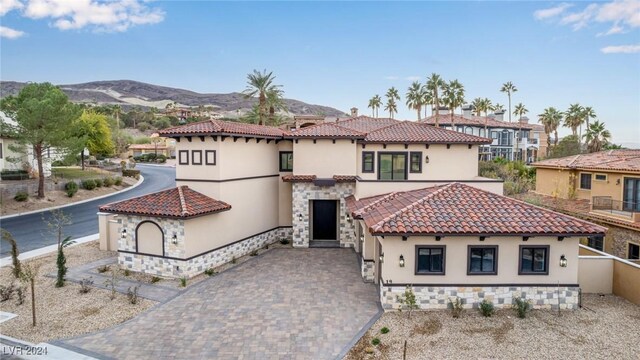 mediterranean / spanish house with a mountain view