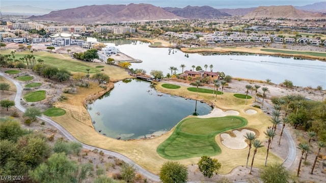 birds eye view of property featuring a water and mountain view