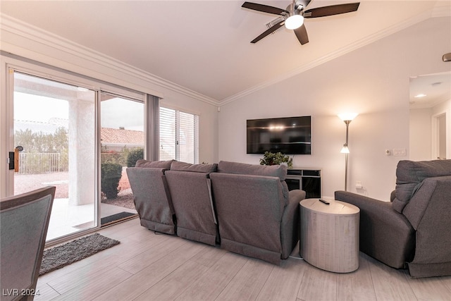 living room featuring a ceiling fan, lofted ceiling, crown molding, and wood finished floors