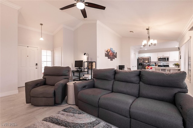 living area featuring baseboards, light wood finished floors, and crown molding