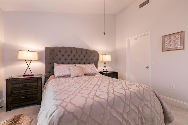 bedroom featuring visible vents and baseboards