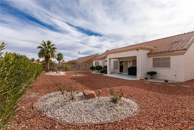 view of yard featuring fence and a patio