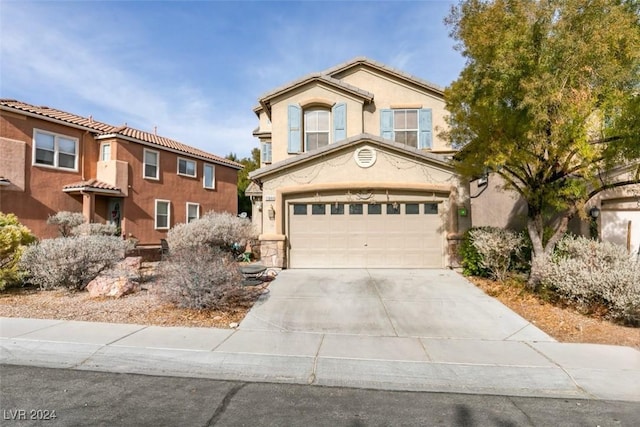 view of front of property with a garage