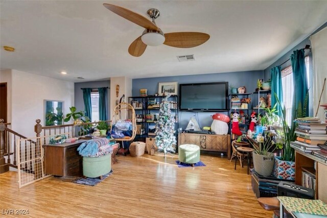 interior space with light wood-type flooring and ceiling fan