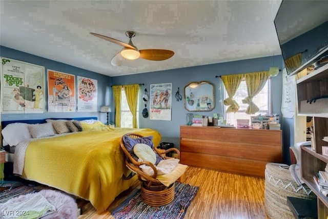 bedroom featuring ceiling fan and wood-type flooring