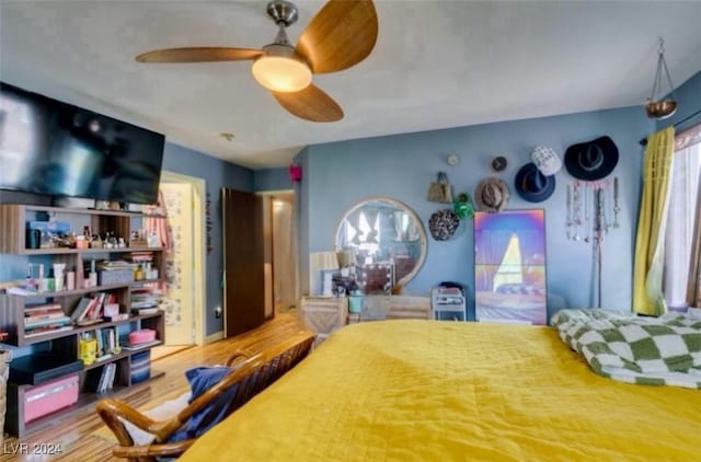 bedroom featuring hardwood / wood-style floors and ceiling fan