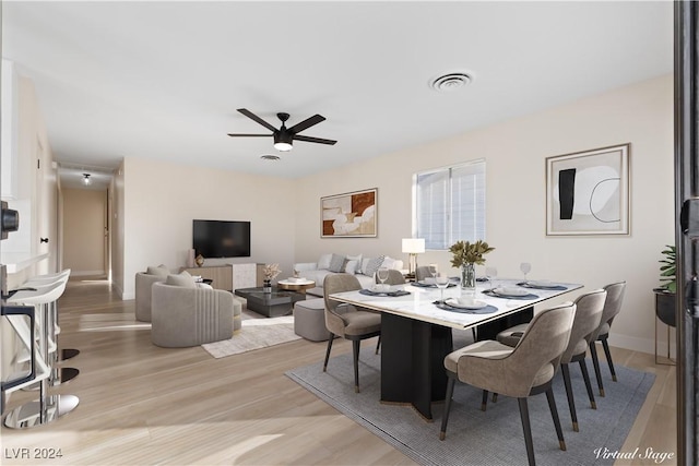 dining room featuring ceiling fan and light wood-type flooring