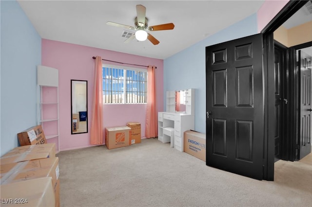 bedroom with light carpet and ceiling fan