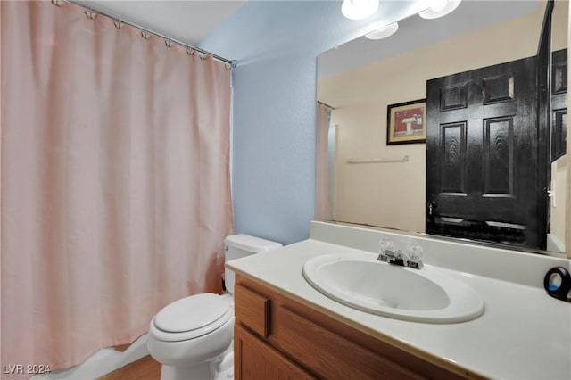 full bathroom with vanity, toilet, and shower / bathtub combination with curtain