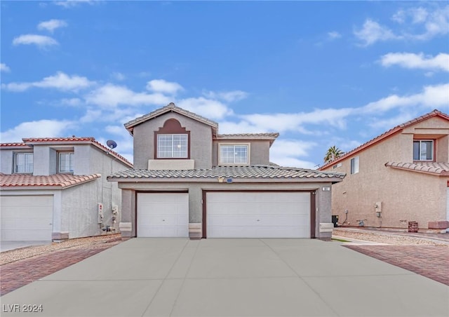 mediterranean / spanish-style home featuring a garage