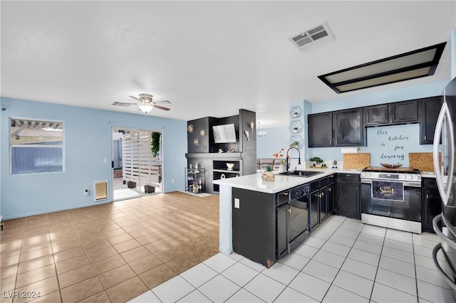 kitchen featuring kitchen peninsula, ceiling fan, sink, stainless steel range oven, and black dishwasher