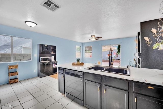 kitchen featuring a textured ceiling, ceiling fan, sink, and black dishwasher