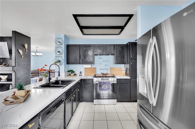 kitchen featuring sink, a chandelier, pendant lighting, light tile patterned floors, and appliances with stainless steel finishes