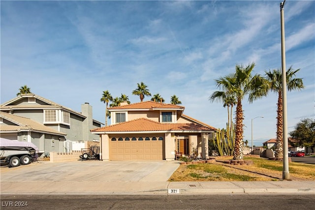 mediterranean / spanish-style home featuring a garage