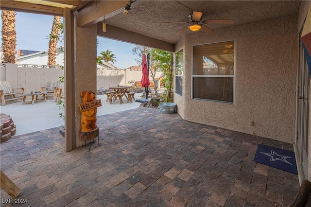 view of patio / terrace featuring ceiling fan