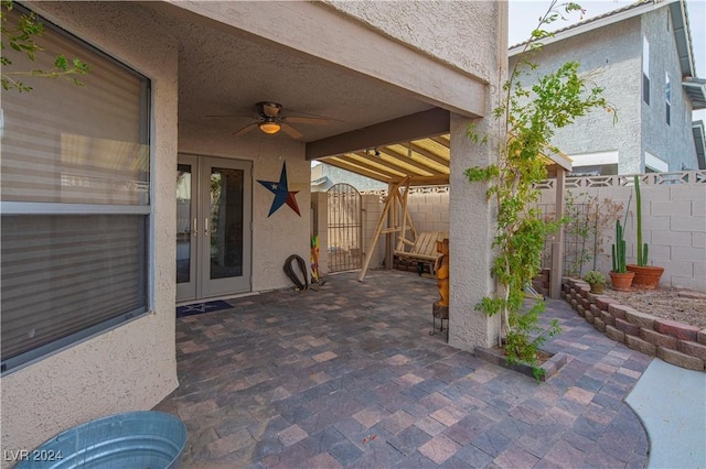 view of patio / terrace with french doors and ceiling fan