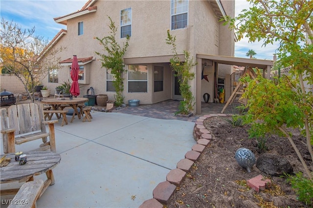 rear view of house featuring a patio area