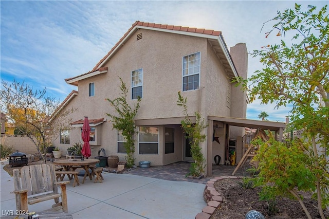 back of house with a patio area