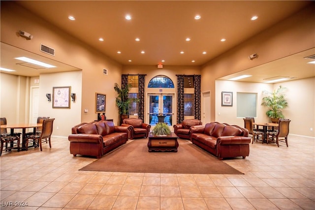 living area with light tile patterned floors, visible vents, baseboards, and recessed lighting