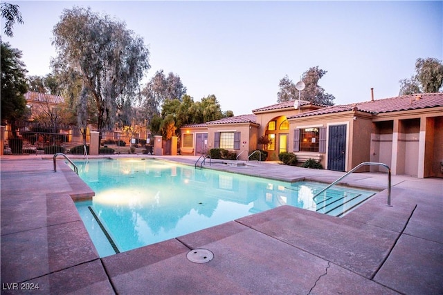 view of swimming pool featuring a fenced in pool, a patio, and fence