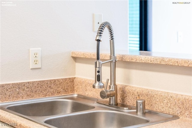 details featuring light countertops and a sink