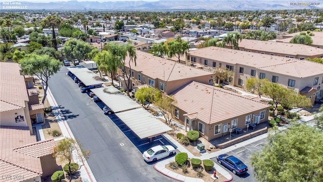 birds eye view of property featuring a mountain view and a residential view